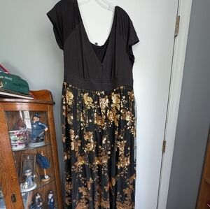 Plus size woman black and gold dress